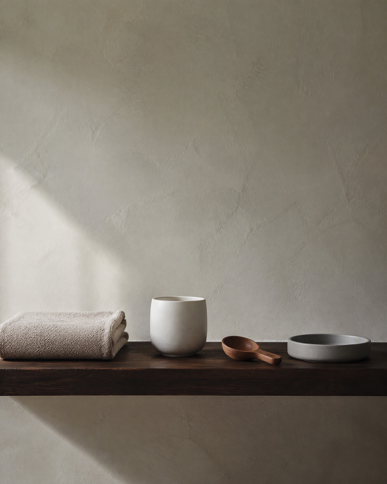 Bath and home ritual accessories arranged on a stone tray