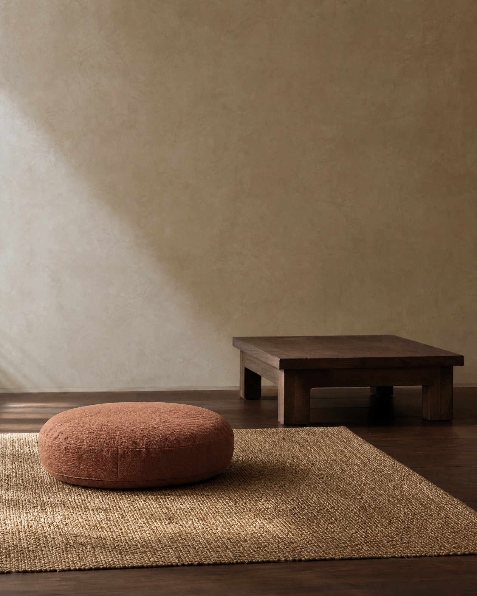 Meditation cushion and floor-seating accessories in a quiet reading corner